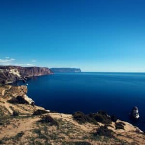 body of water surrounded by rock