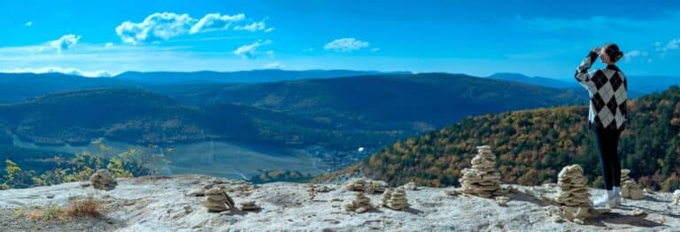 A person standing on top of a mountain
