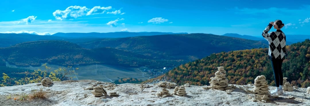 A person standing on top of a mountain